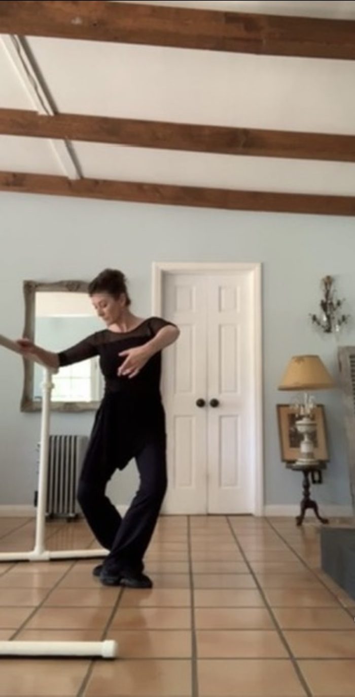 Brigid demonstrating ballet technique at the barre